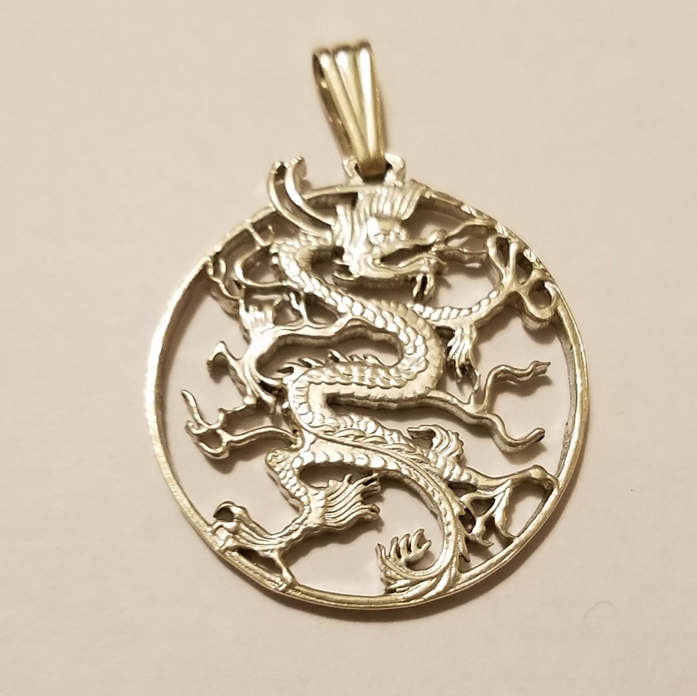 Vintage laser cut silver coin dragon pendant